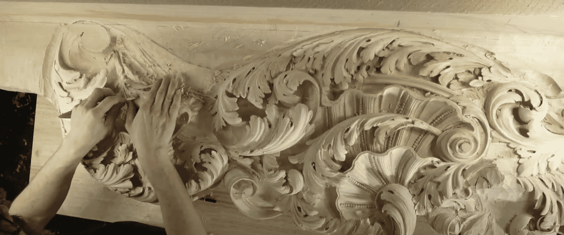 Hands using a carving knife to create intricate wood carving details with floral patterns. Knives- Wood Carving techniques displayed.
